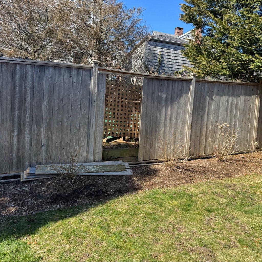 Weathered fence before replacement